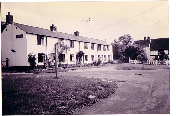a black and white photo of cottages | Eric Edwards