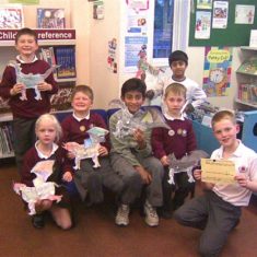 students holding paper dragons | Hertfordshire Library Service